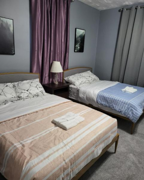 Guest room with two double beds in Columbus Oh, Airport location